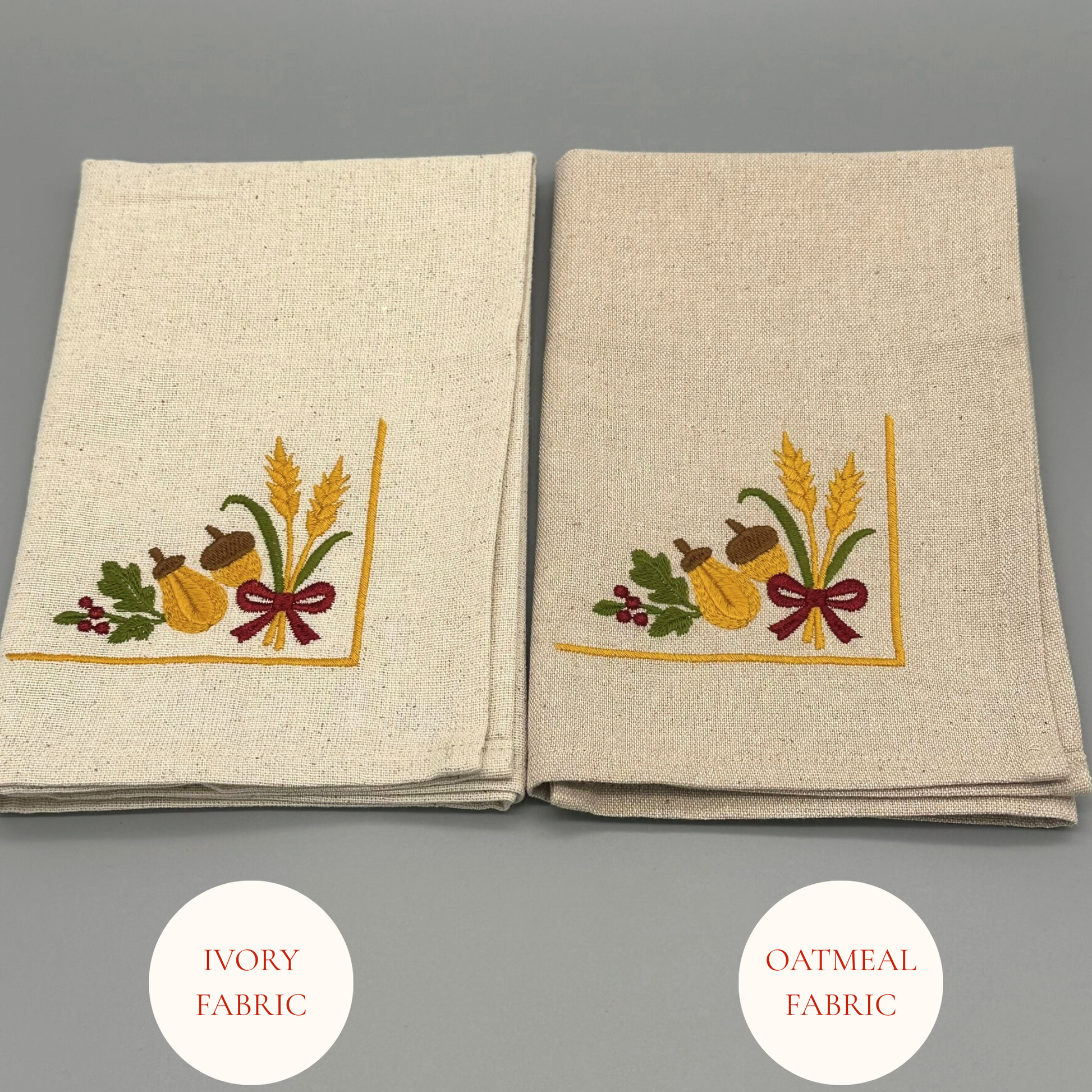 Two folded napkins with oak leaves, acorns, and wheat, and a ribbon design 