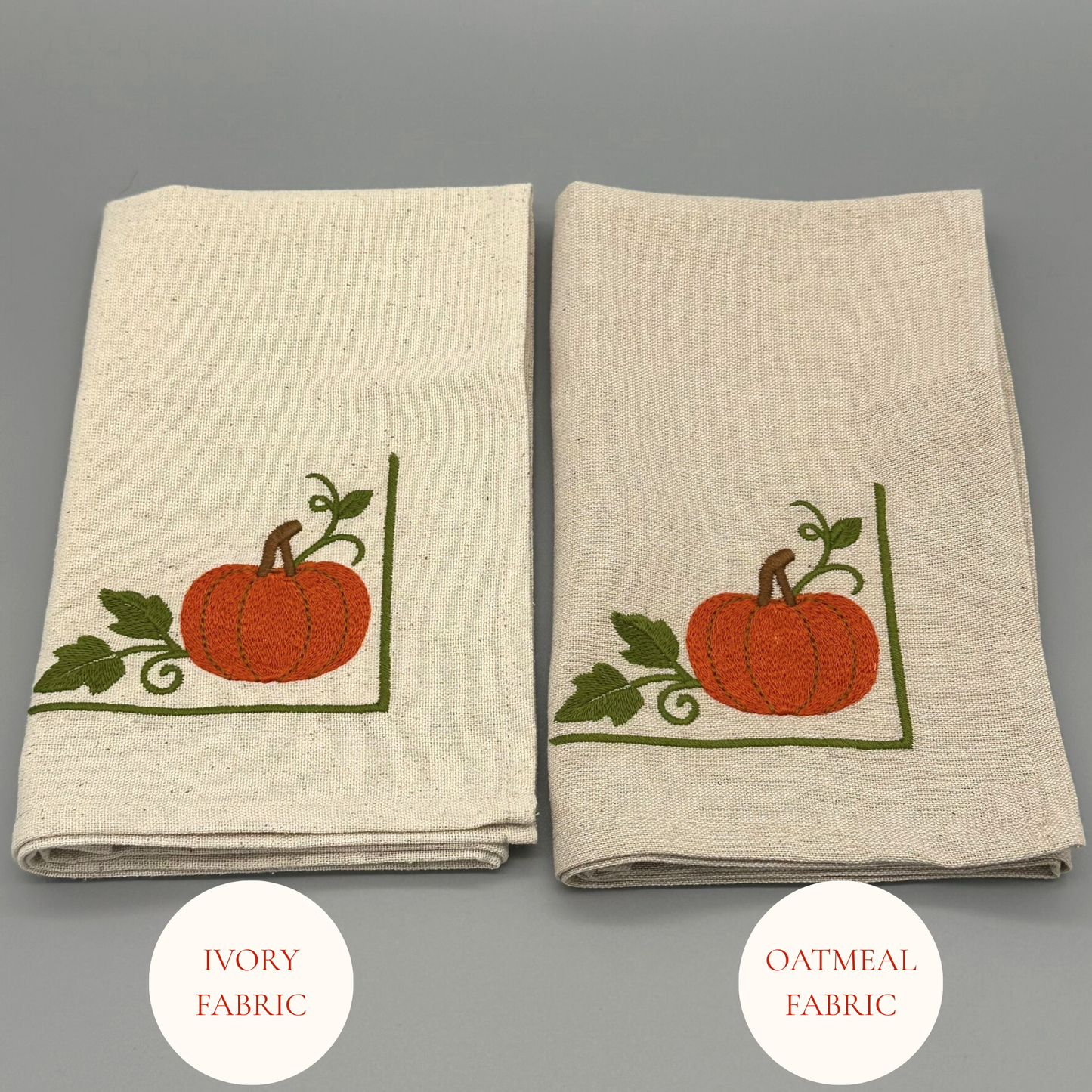 Two folded napkins with embroidered pumpkins