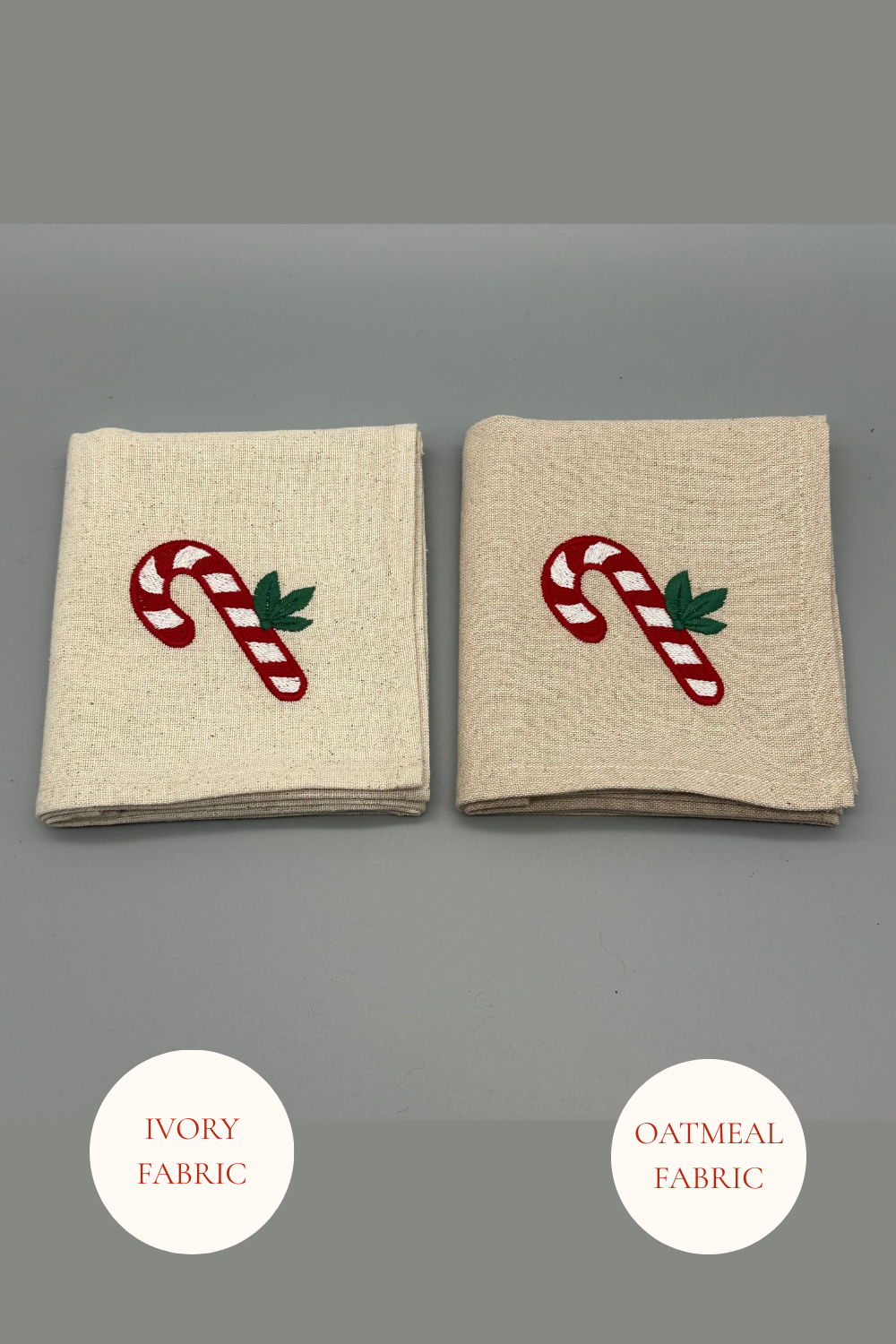 Two folded candy cane embroidered  napkins in Oatmeal and Ivory