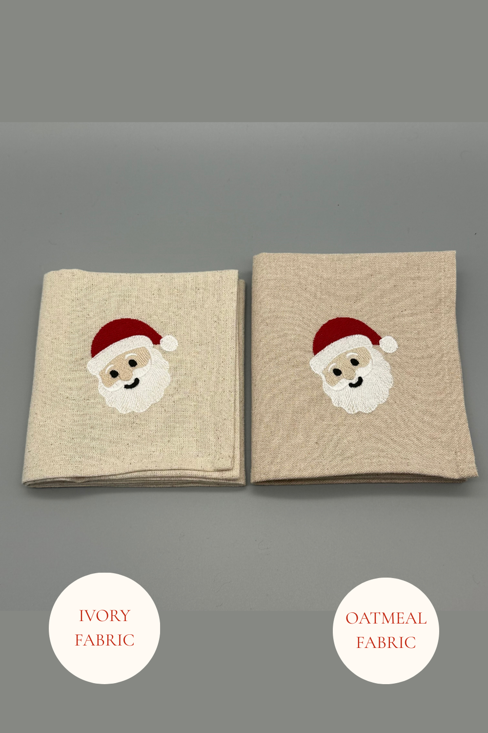 Two folded Santa embroidered  napkins in Oatmeal and Ivory