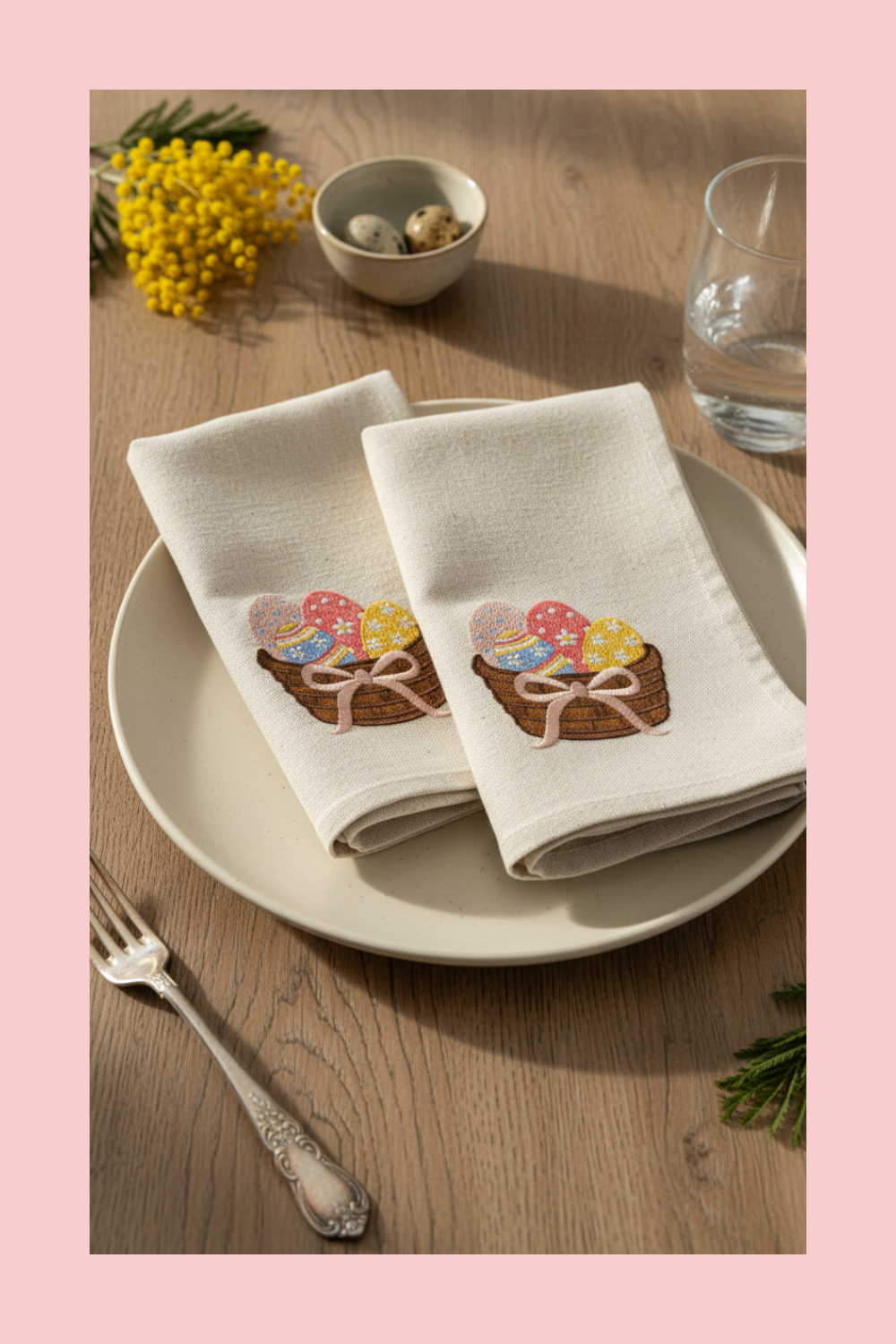 Napkins with Easter-themed design on a plate with a fork and glass of water on a wooden table.