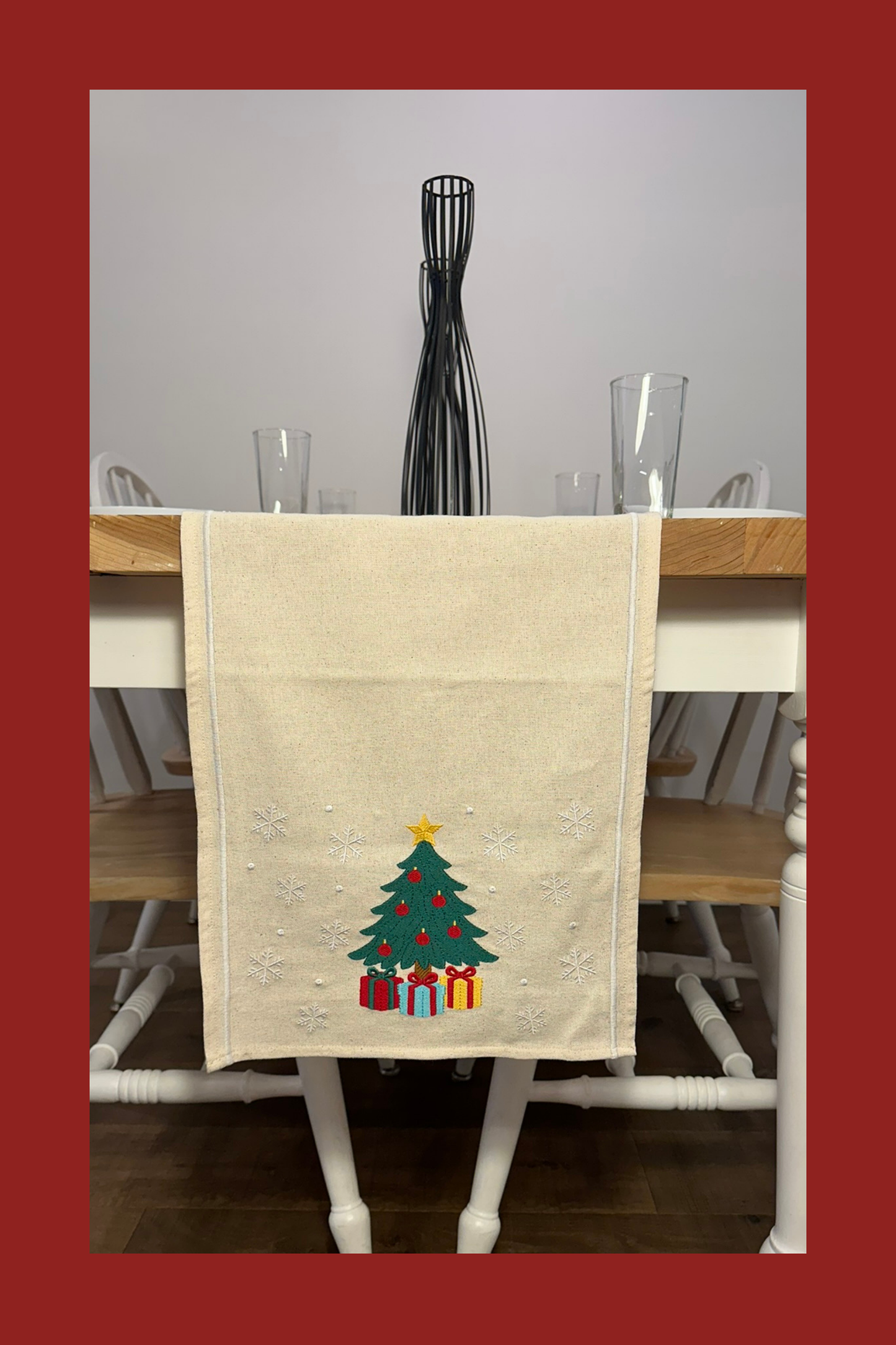 Ivory table runner with embroidered Christmas tree and gifts