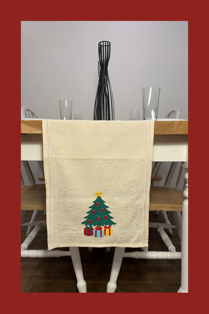 Ivory table runner with embroidered Christmas tree and gifts