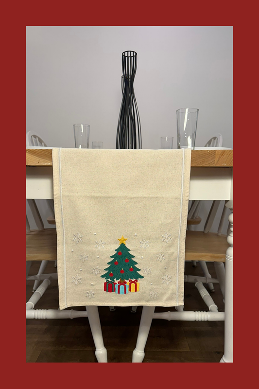 Ivory table runner with embroidered Christmas tree and gifts